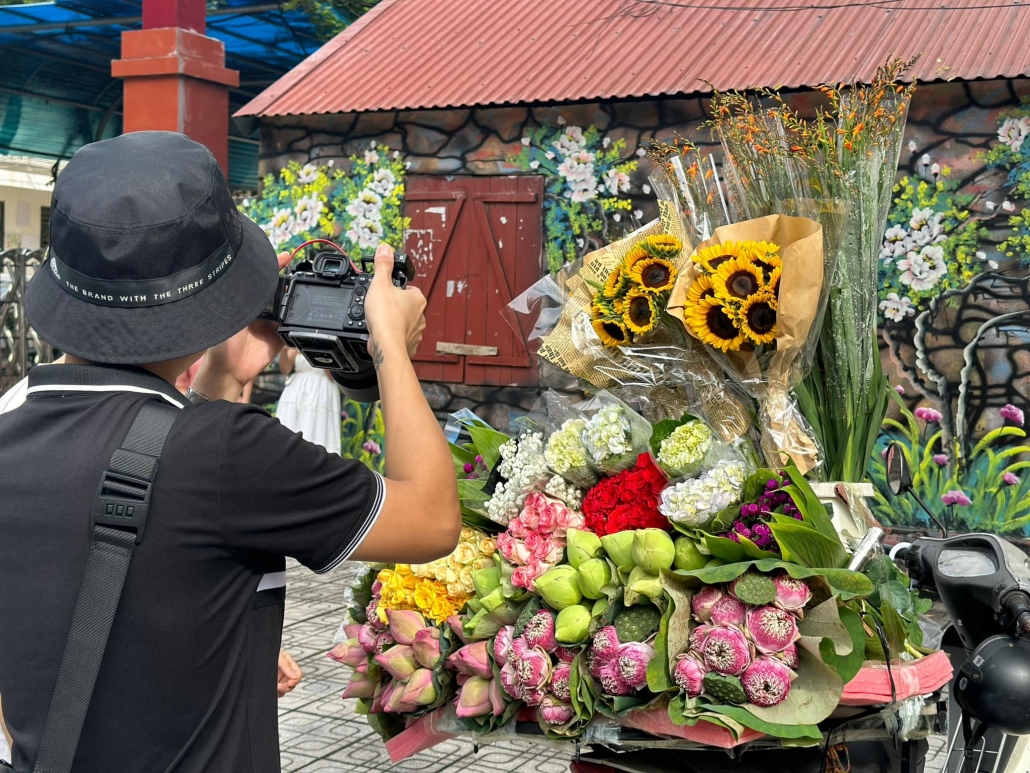 Young people in trend of check-in with flower bike on the streets