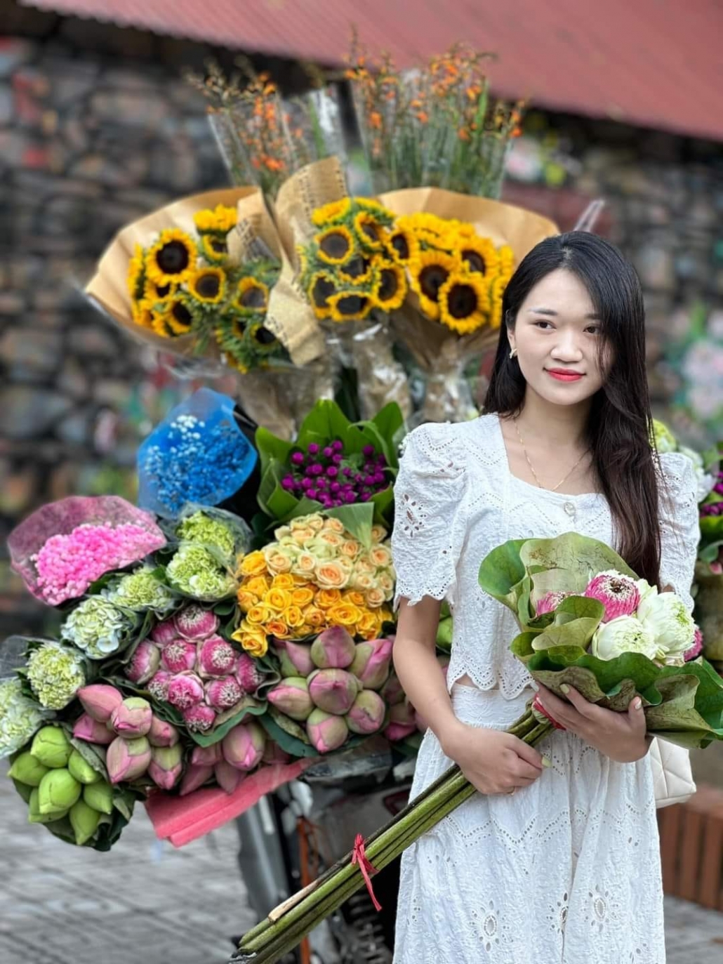 Young people in trend of check-in with flower bike on the streets