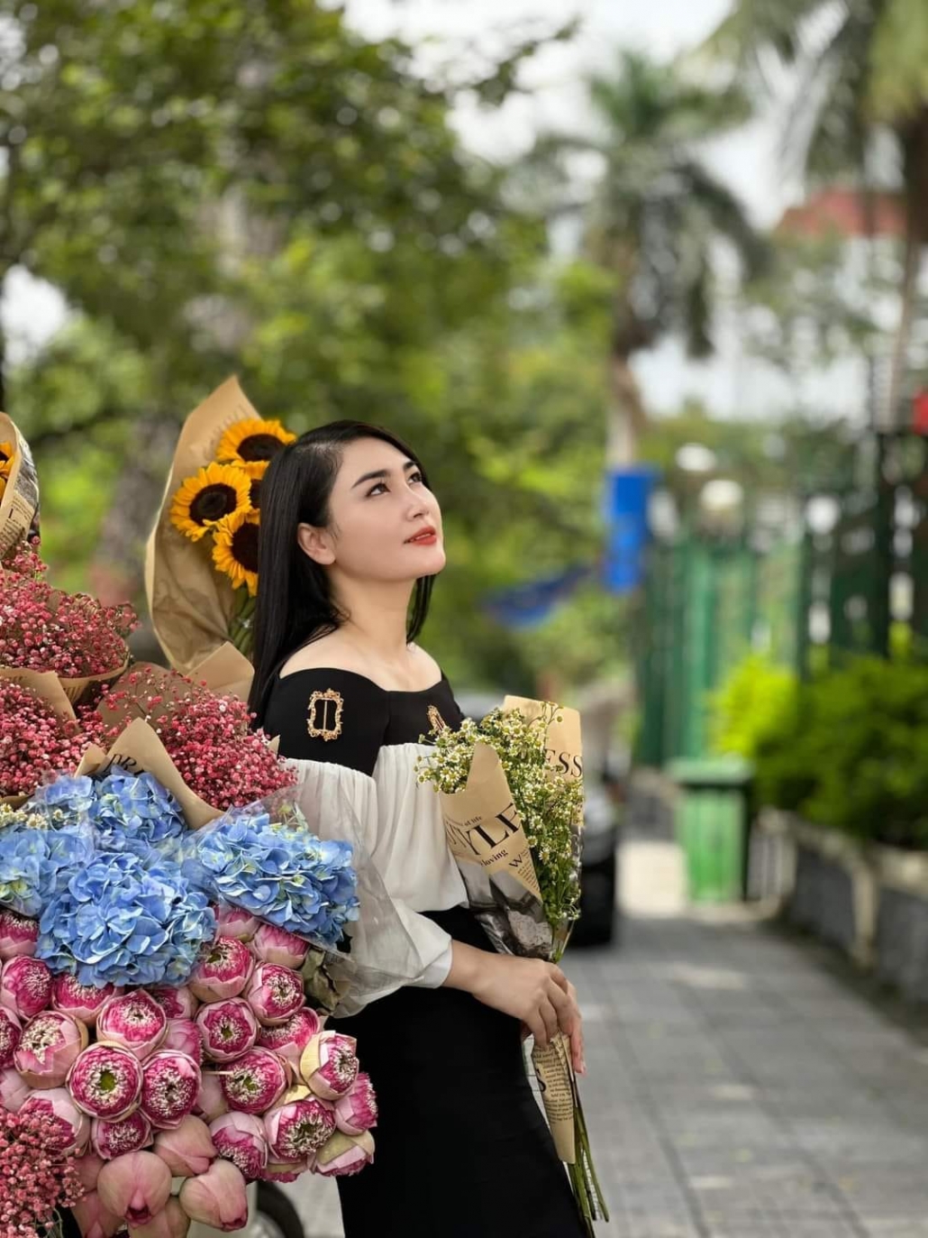 Young people in trend of check-in with flower bike on the streets