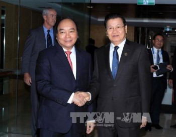 Hội nghị Cấp cao đặc biệt ASEAN - Australia: Thủ tướng Nguyễn Xuân Phúc gặp Thủ tướng Lào